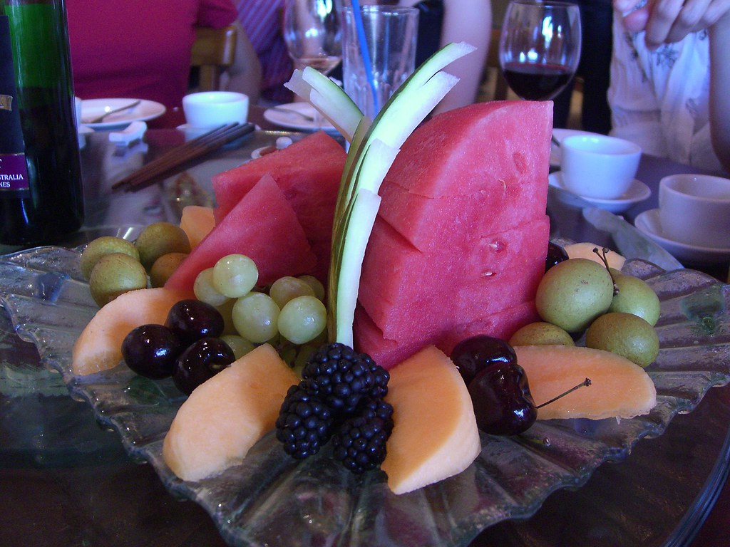 Platter of fresh sliced watermelon, melon, grapes and berries